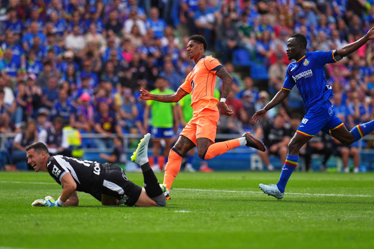 Barcelona's Marcus Rashford scores his side's 2nd goal during the Spanish La Liga football match between Getafe and Barcelona in Getafe, Spain on April 25, 2026. (AP Photo/Manu Fernandez)