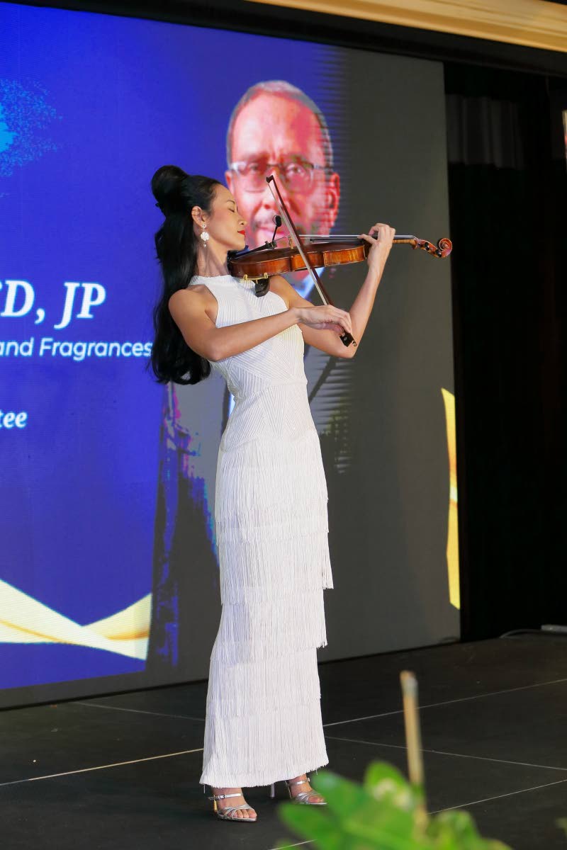 Yap serenades the audience as Howard Mitchell is inducted as the 29th Private Sector Organisation of Jamaica Hall of Fame honouree in 2023.