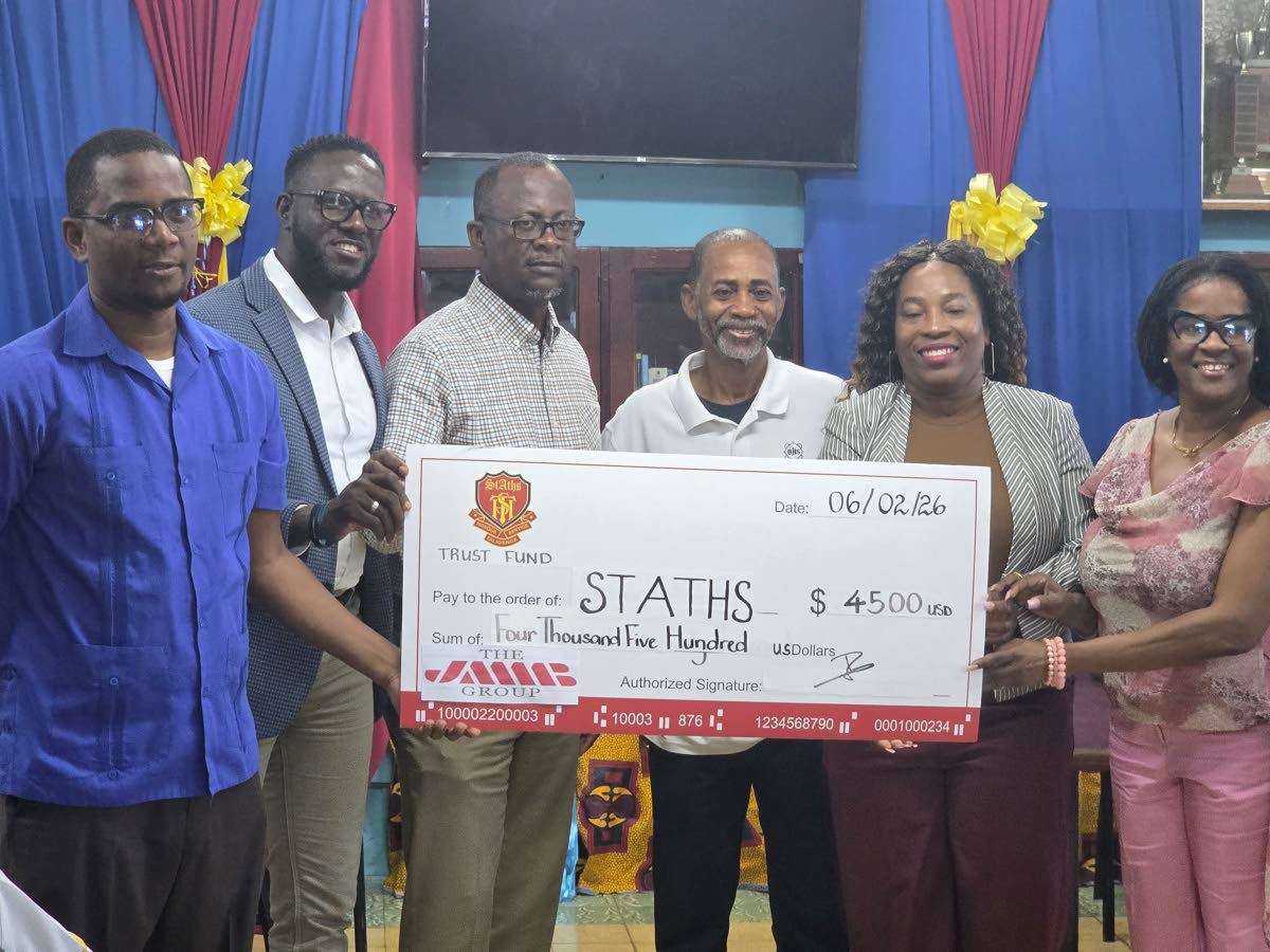 STATHS Trust members pose with a symoblic cheque presented to the institution as a part of the Trust’s sustained commitment to make a tangible difference.