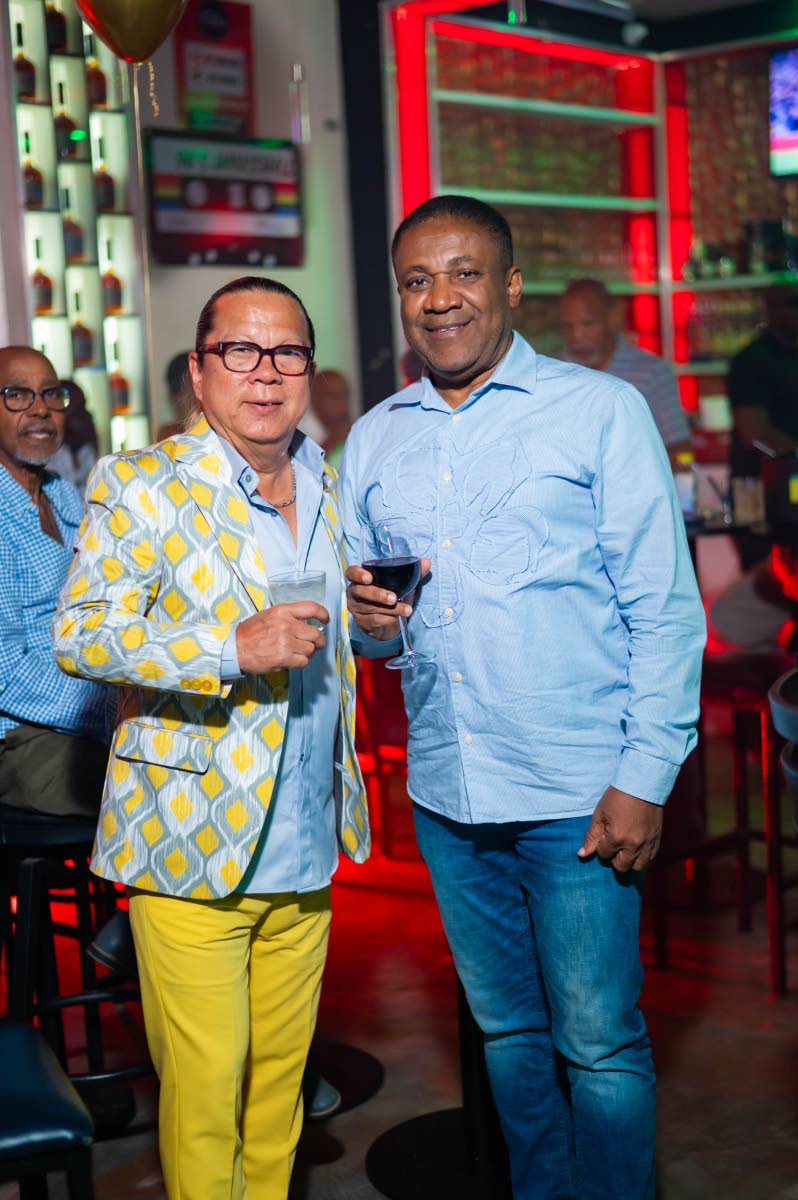 Opposition Spokesman on Energy Phillip Paulwell (right) came out to celebrate with Brian ‘Ribbie’ Chung. 