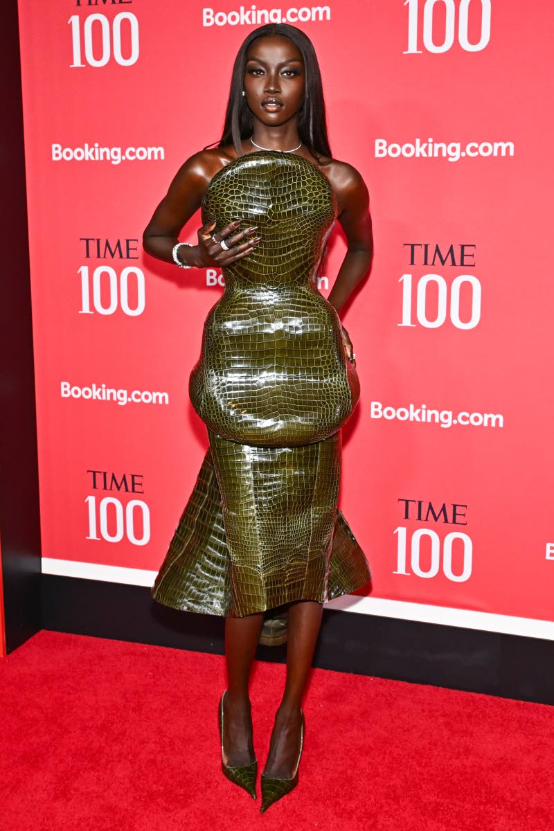 Honoured in the Titans category, Anok Yai commands attention in a crocodile-textured, sculpted midi dress by Ashi Studio.