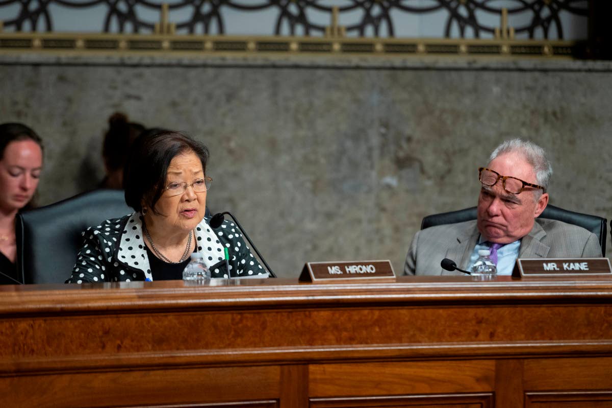 Senator Mazie Hirono, D-Hawaii, left, questions a witness as Senator Tim Kaine, D-Va., right, looks on during the Senate Committee on Armed Services hearing on Capitol Hill in Washington, Tuesday, April 28, 2026. (AP Photo/Cliff Owen)