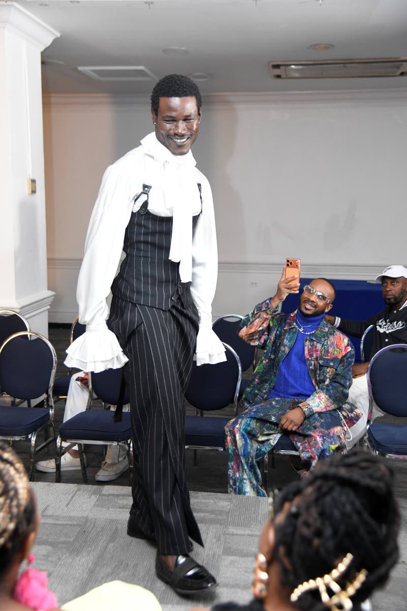  Mr Jamaica World 2024 Tarique Barrett is all smiles as he poses on the runway.