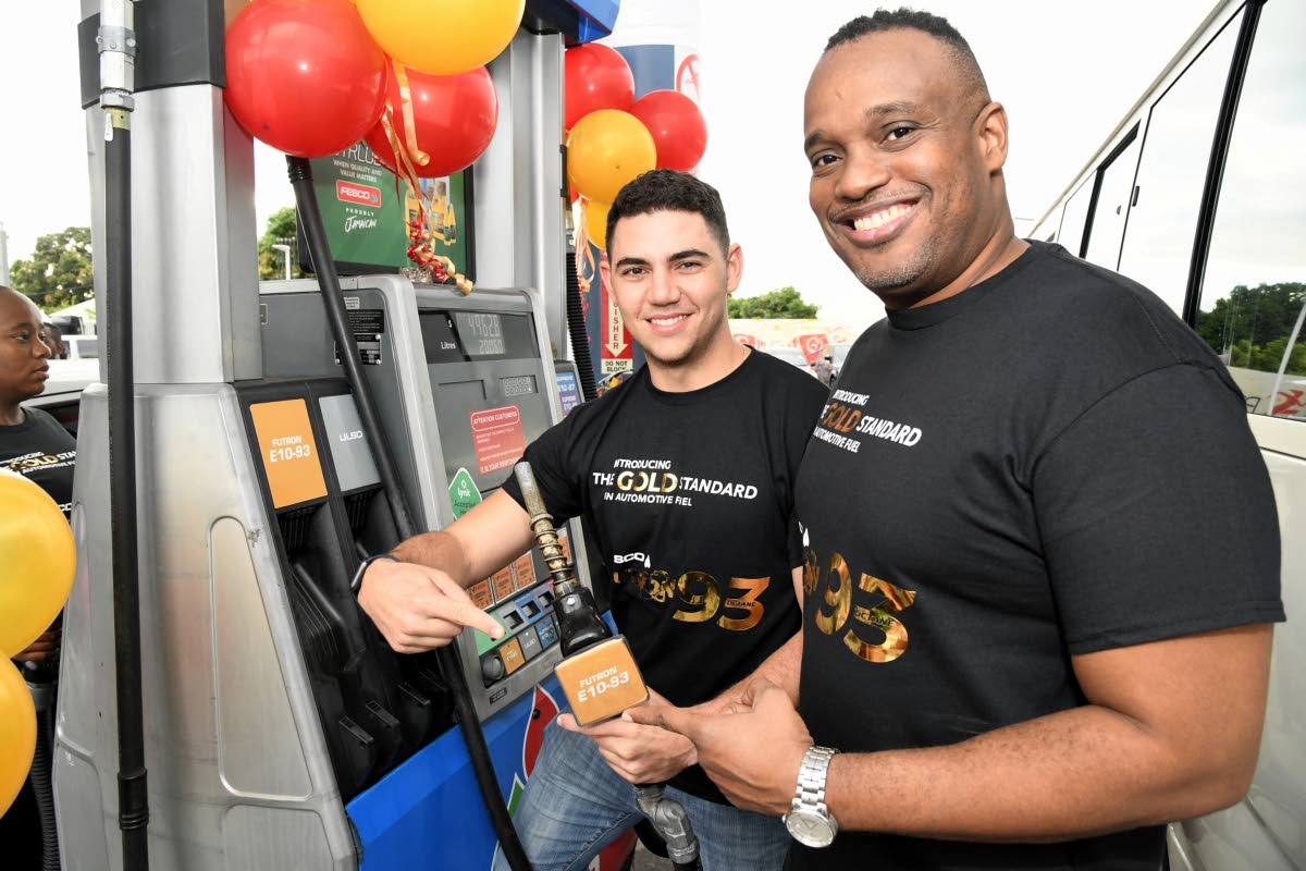 Fraser McConnell (left), Jamaican rally cross driver, and Jeremy Barnes, managing director of Fesco, at the launch of FESCO Futron 93 Octane Gold standard in automotive fuel at the FESCO station on Beechwood Avenue in Kingston on  Friday, December 9, 2022.