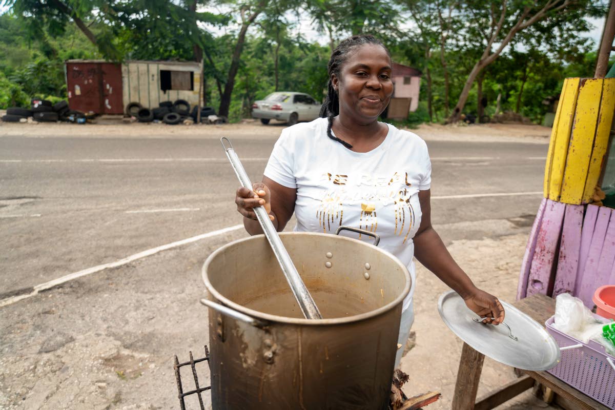 Sean Blake, who runs a cookshop at Gutters, received a stove and other inputs to restart her business.