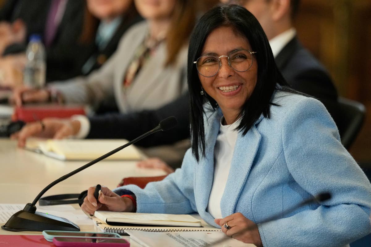 FILE - Venezuela's acting President Delcy Rodriguez smiles during a meeting with a delegation led by US Energy Secretary Chris Wright at Miraflores Palace in Caracas, Venezuela, February 11, 2026. 
