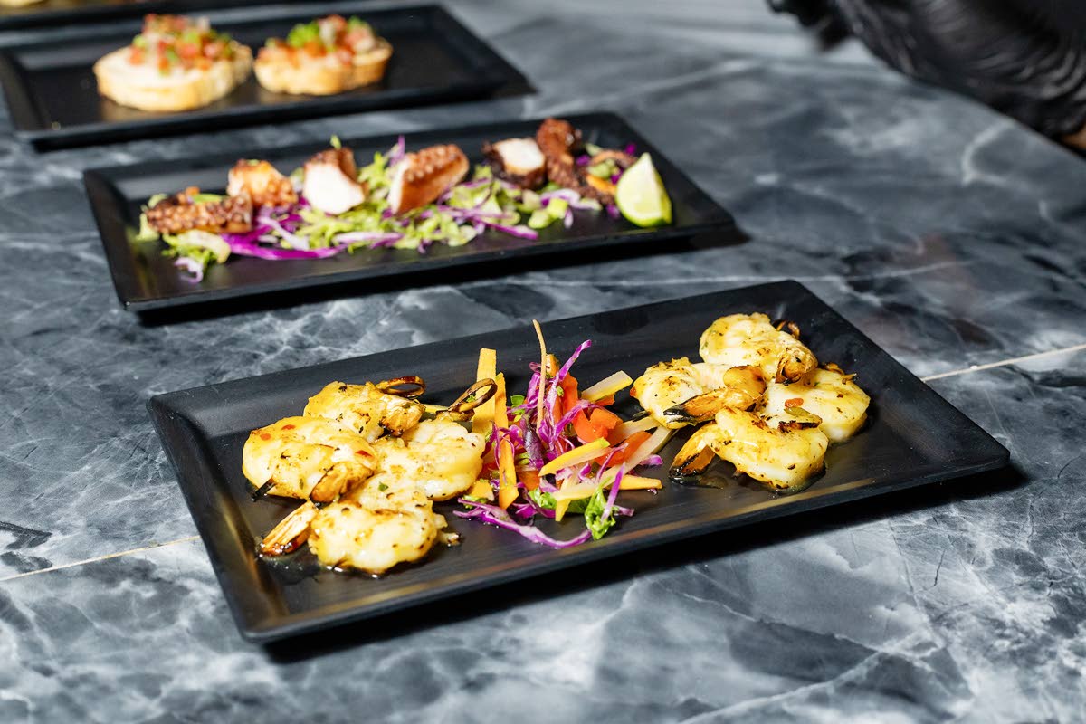 These passion shrimp skewers are brushed with honey‑lime chilli glaze and finished with fresh mint.
