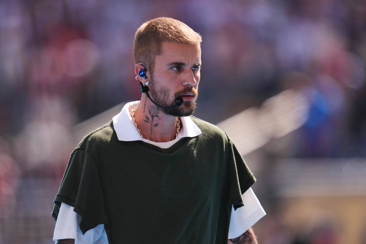 Justin Bieber leaves the pitch after performing at halftime during the World Cup final soccer match between Spain and Argentina on Sunday.