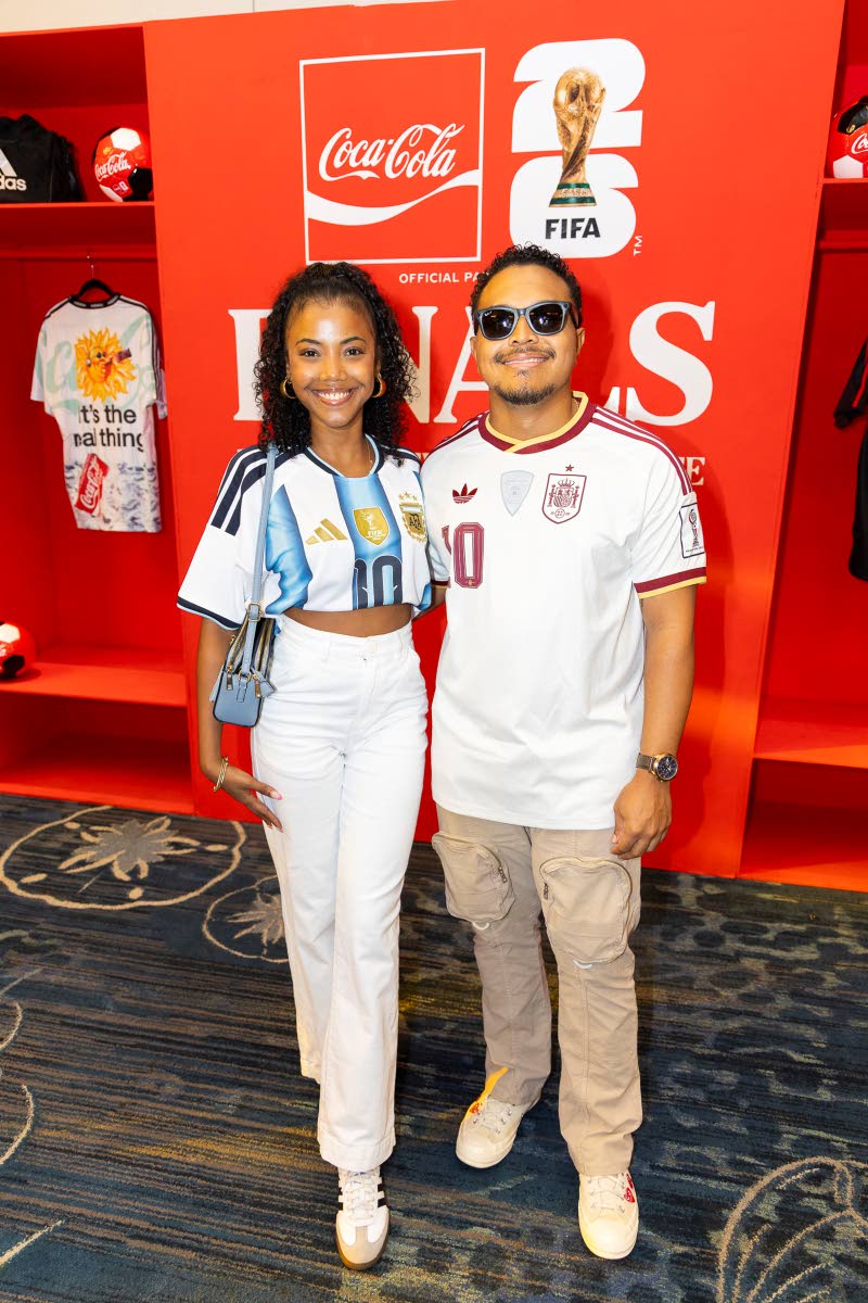 Nico Lee and Mickala Simmonds show off their team colours at the Coca-Cola World Cup final experience.