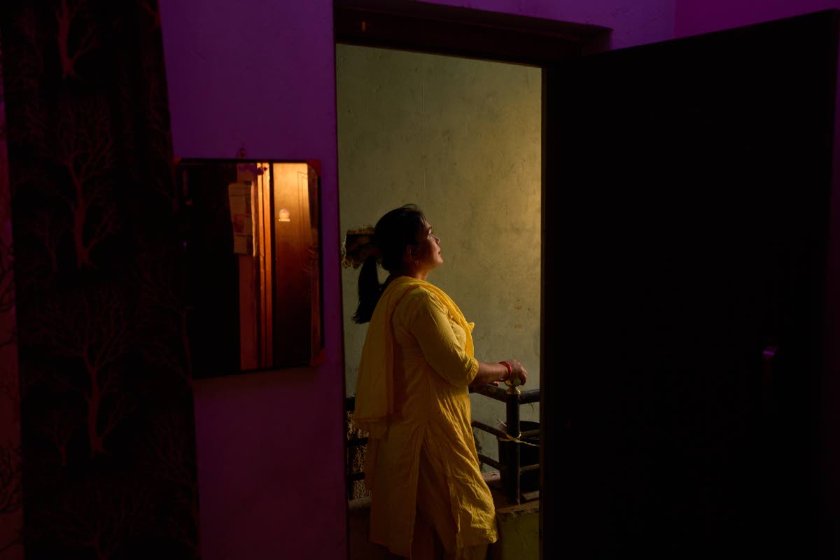 Bharati Thapa, a former HIV outreach worker who turned to sex work to survive after losing her job amid the US foreign aid cuts, poses for a portrait outside the office of her former NGO.