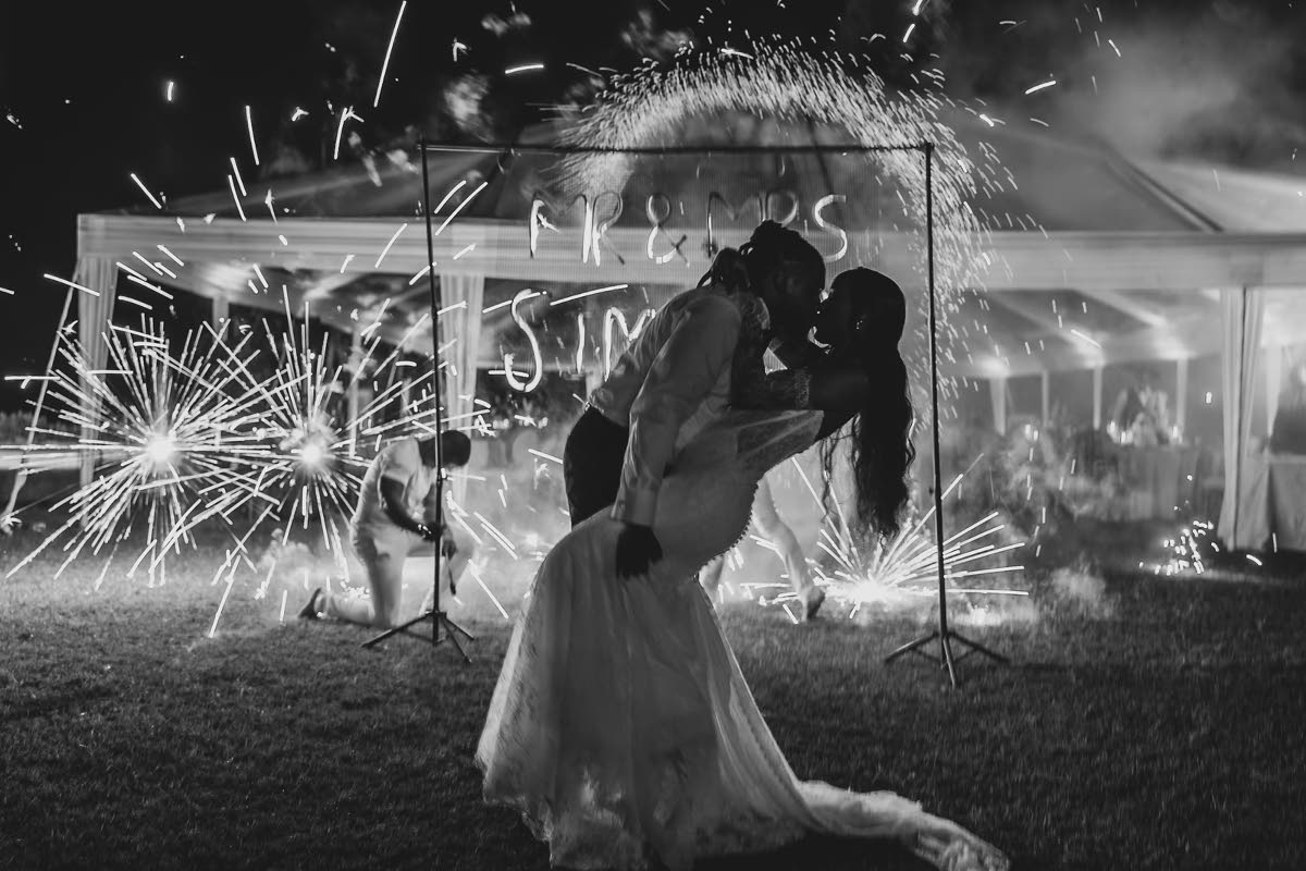 Pyro Fanatics brought the heat as Mr and Mrs Simpson shared a kiss during a fire show at The Palms Rose Hall.