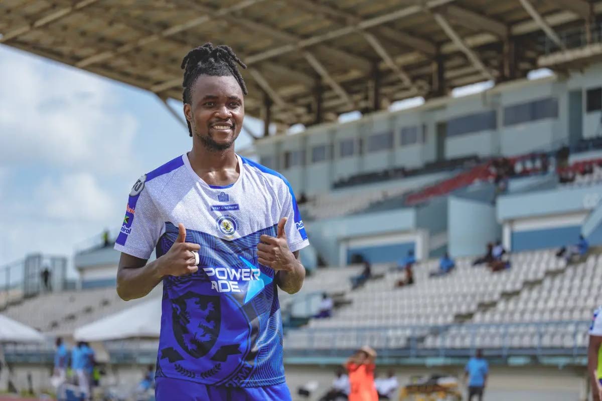 Mount Pleasant’s Johnson Juedy gives a thumbs up after scoring in the quarterfinal of the Caribbean Club Shield against Weymouth Wales at the Larry Gomes Stadium in Arima, Trinidad. 