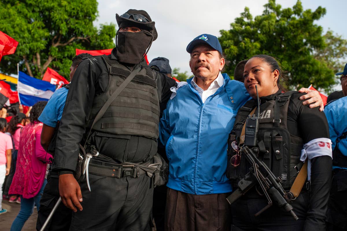 Nicaraguan police have their picture taken with President Daniel Ortega, in Masaya, Nicaragua.