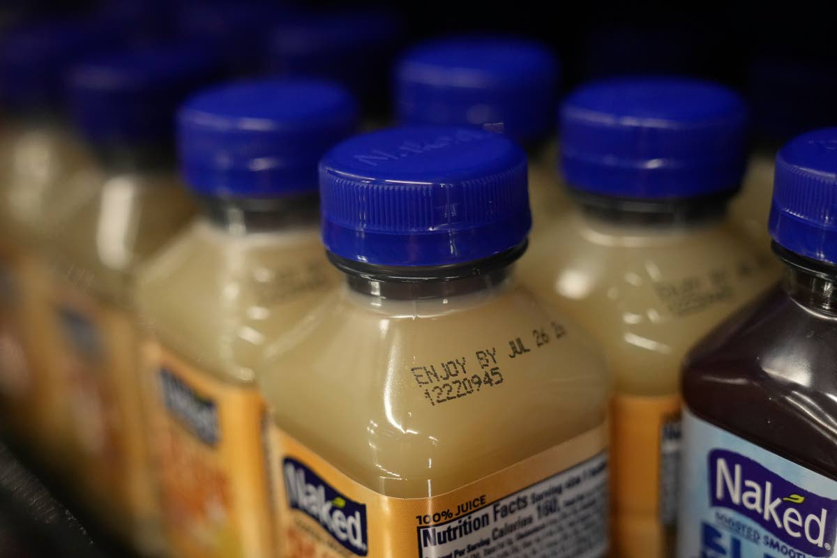 An Enjoy By date is stamped on a drink.