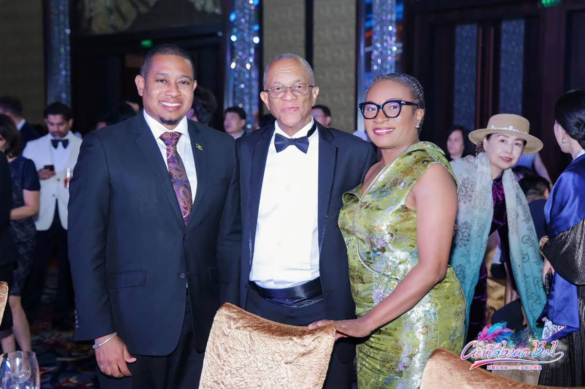 
Jamaica’s ambassador to China, Arthur Williams (centre), and his wife Jala, with Minister of Agriculture, Fisheries and Mining Floyd Green during an event in China.