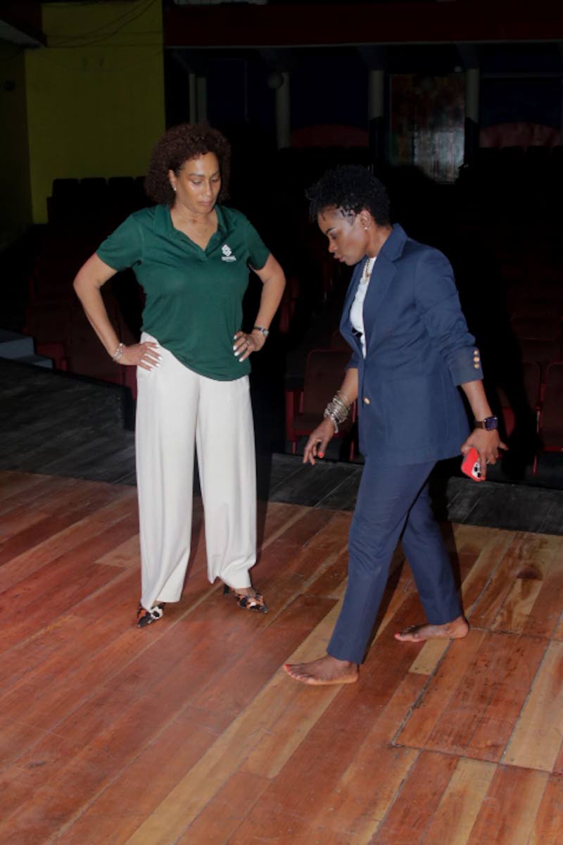  Supreme Ventures Foundation Director Heather Goldson (left) is shown the newly restored stage flooring by Marisa Benain, executive director of the Little Theatre. During the site visit, Benain highlighted how much safer the renovated stage is now for perf