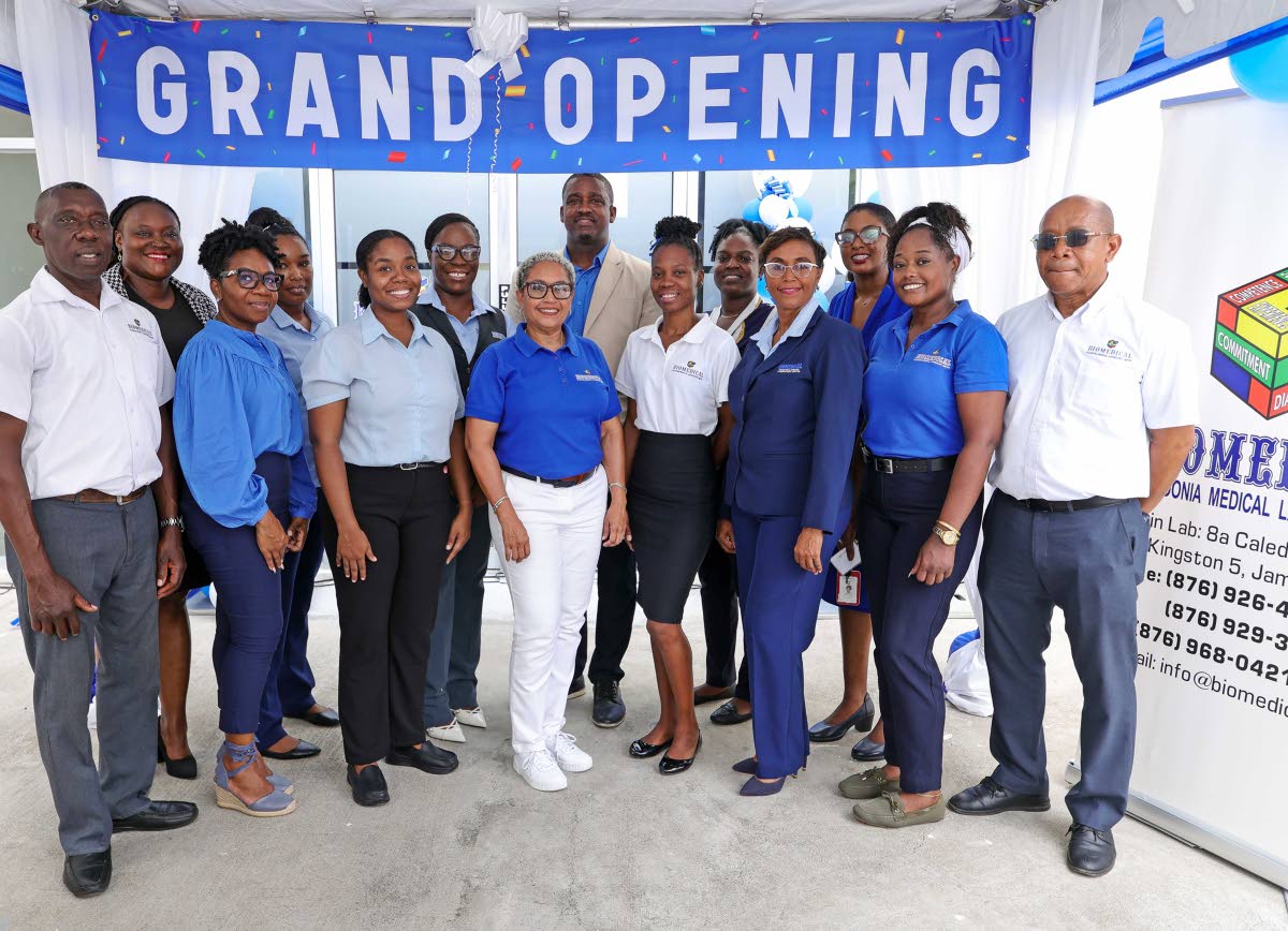 Helen Christian (centre), CEO at Biomedical, joins staff members for a photo op following the official opening on July 14 of the laboratory’s newest collection centre, located at the Annex-A, Knutsford Business Centre in Drax Hall, St Ann. 