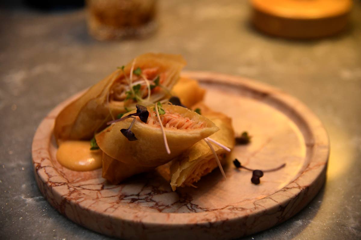 The crab Rangoon with crab, sriracha crème and chives.