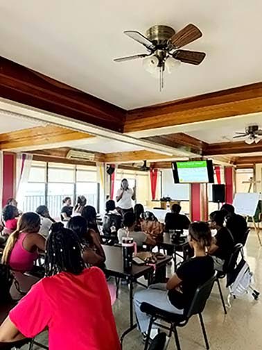 Shauna Todd, project liaison/coordinator at the Institute of Law and Economics, delivers a presentation on financial literacy.
