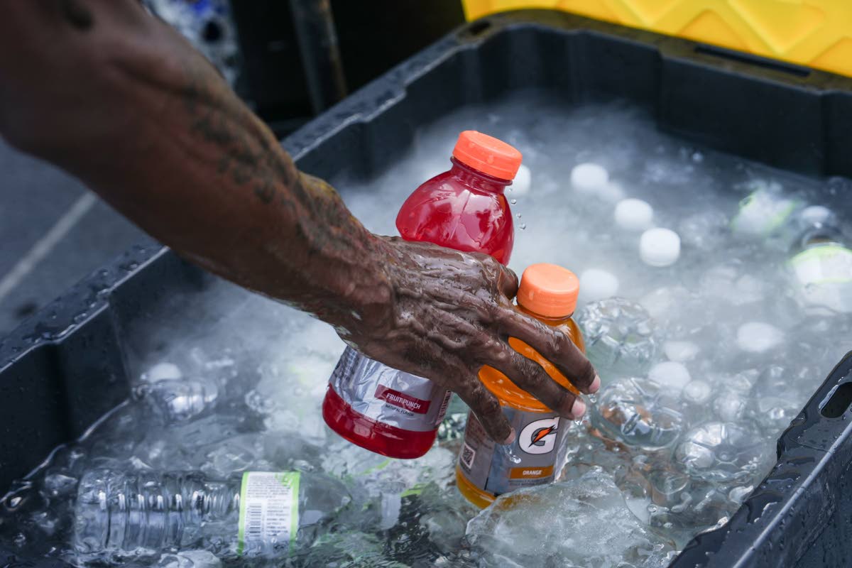 A vendor sells Gatorade and water bottles near the Washington Monument during a heatwave, July 3 in Washington. 