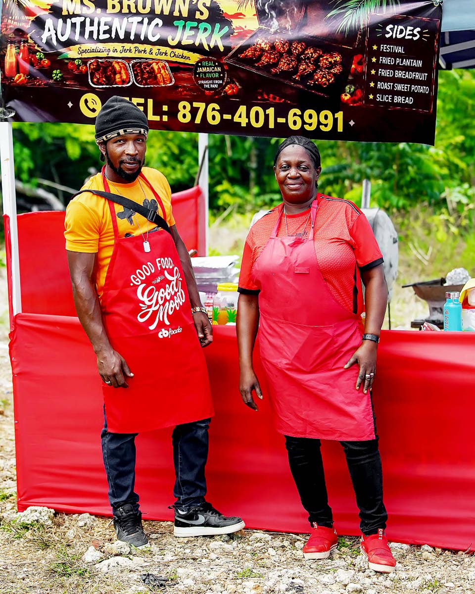 Marilyn Brown (left), of Ms Brown’s Authentic Jerk, who placed third in the Walkerswood Jerk Competition, is joined by her assistant, Tashane Lynch.