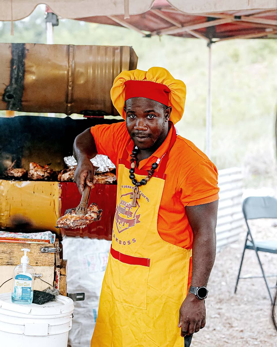 Troy Clarke of Troy’s Mobile Jerk Hut celebrates after securing second place in the Walkerswood Jerk Competition.