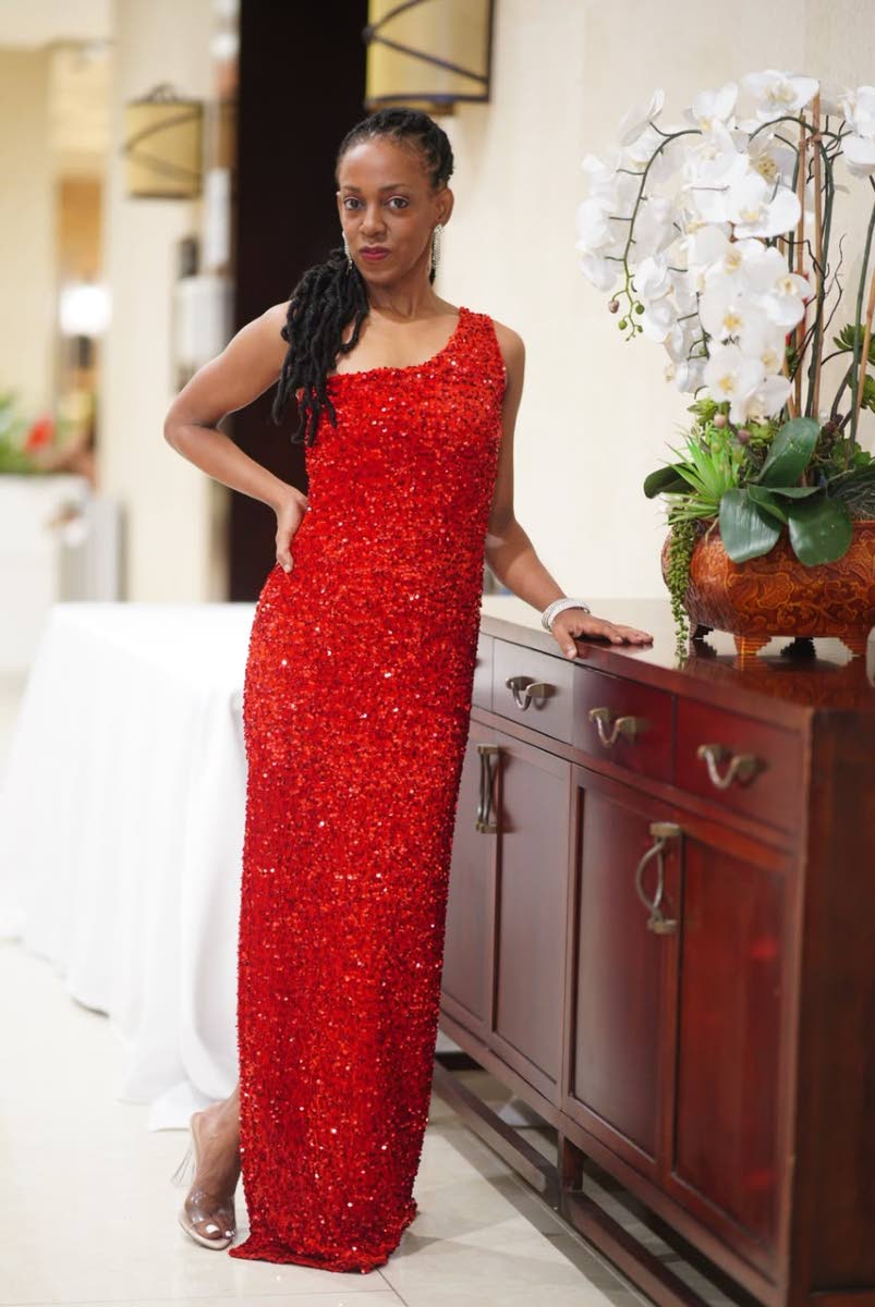 Singer Keisha Patterson, following her well-received Jazz in the Gardens performance at The Jamaica Pegasus, stuns in red-hot evening wear. 