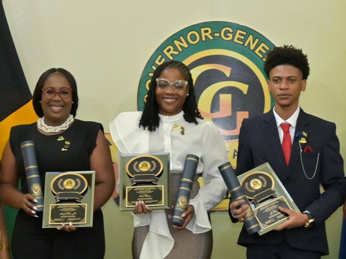 2026 Governor-General’s Achievement Award (GGAA) recipient, Kaydia Clair (left), poses alongside fellow St Catherine awardees Sasha Williams and Joel Shaw at the 2026 GGAA ceremony.