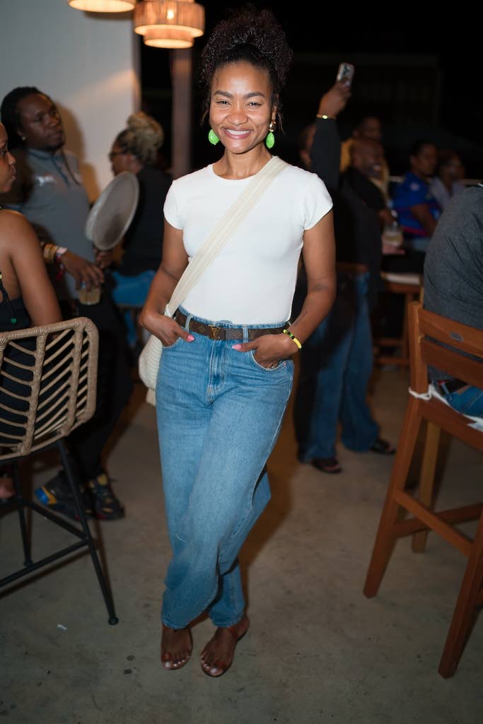 Nastassia Morrison, founder and chief executive officer of HomeMaid Jamaica, pairs a classic white T-shirt with relaxed denim. 