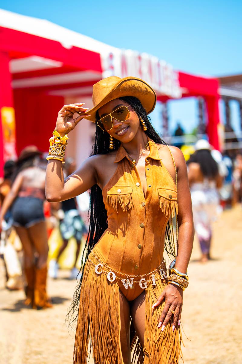 Jewel Jones is ready to shake up the saloon in head-to-toe fringe, topping off her golden cowgirl moment with a hat and plenty of swagger.