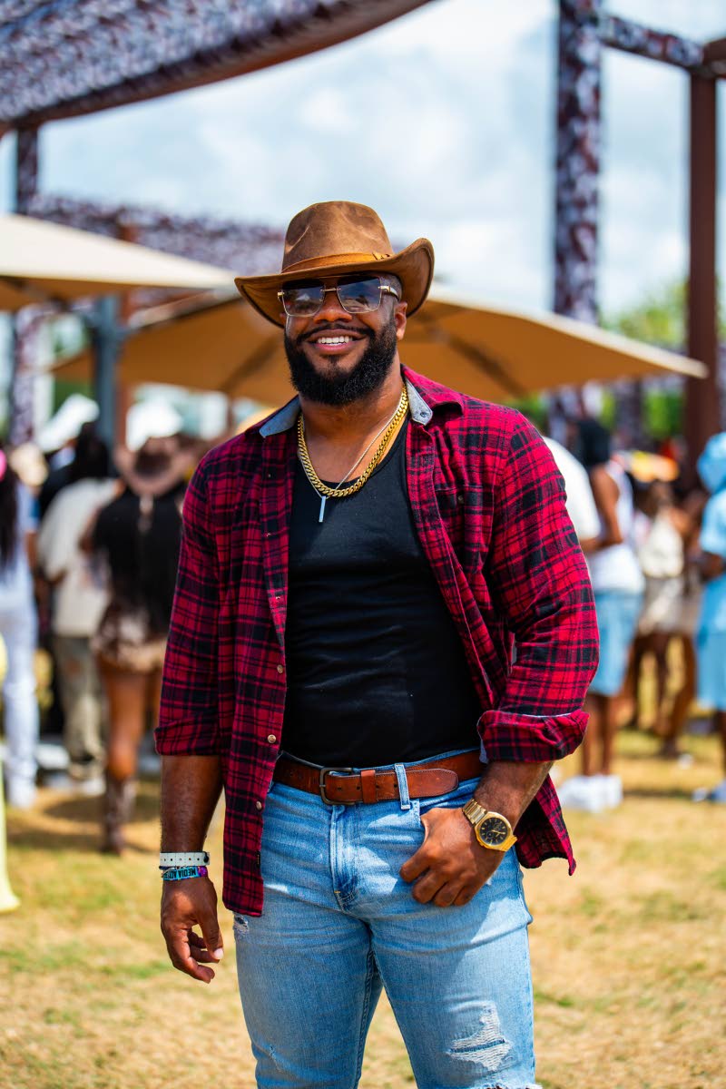 Media professional Andre Skeen keeps his cowboy look standard with denim, plaid and a brown cowboy hat.