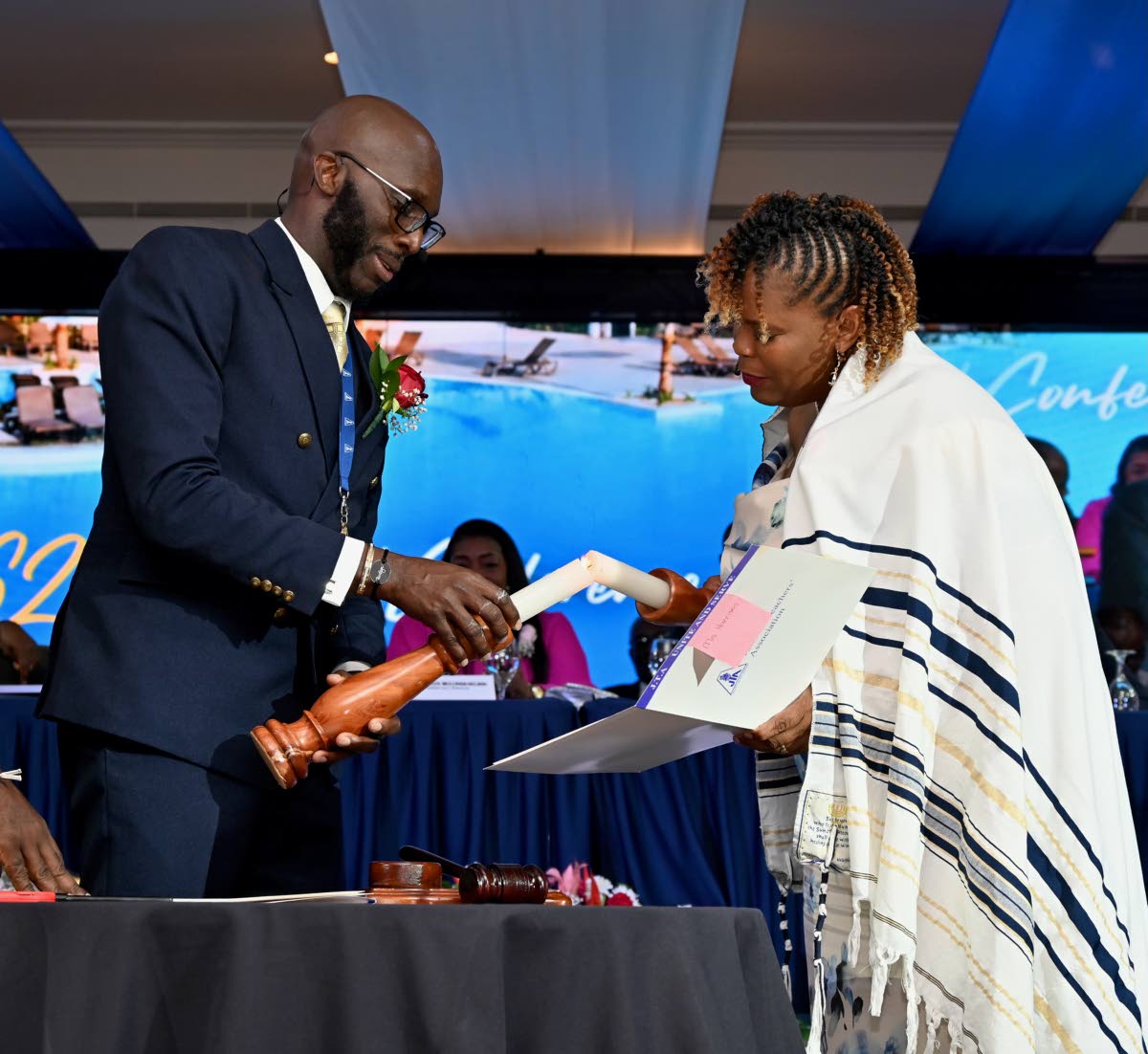 La Sonja Harrison (right), newly installed president of the Jamaica Teachers’ Association, participates in the investiture ceremony with immediate past president Mark Malabver on Monday. Harris previously served as president for the 2022-2023 term.