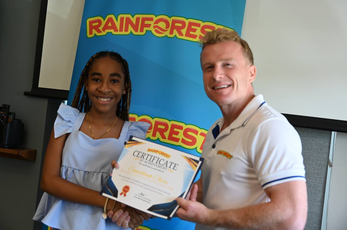 PEP awardee Camilleah Clare accepts her certificate from Benjamin Jardim, business development manager at Rainforest Caribbean.
