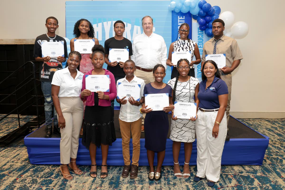 Wisynco Group representatives Francois Chalifour (top row, third right), director, marketing and information technology; Jusanna Staple (front row, left), brand coordinator, WATA Portfolio; and Brittany Thwaites (front row, right), brand manager, WATA Port