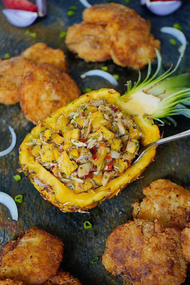 A vibrant salt fish salsa served in a cored pineapple. 