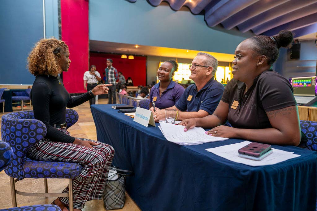 Job applicant Teryann Archer responds to interview questions from (from left) Sherese Robertson-Swaby, assistant entertainment manager; Deivy Garcia, entertainment manager; and Cleopatra Lynton, operative secretary, during Iberostar's Hospitality Expansion