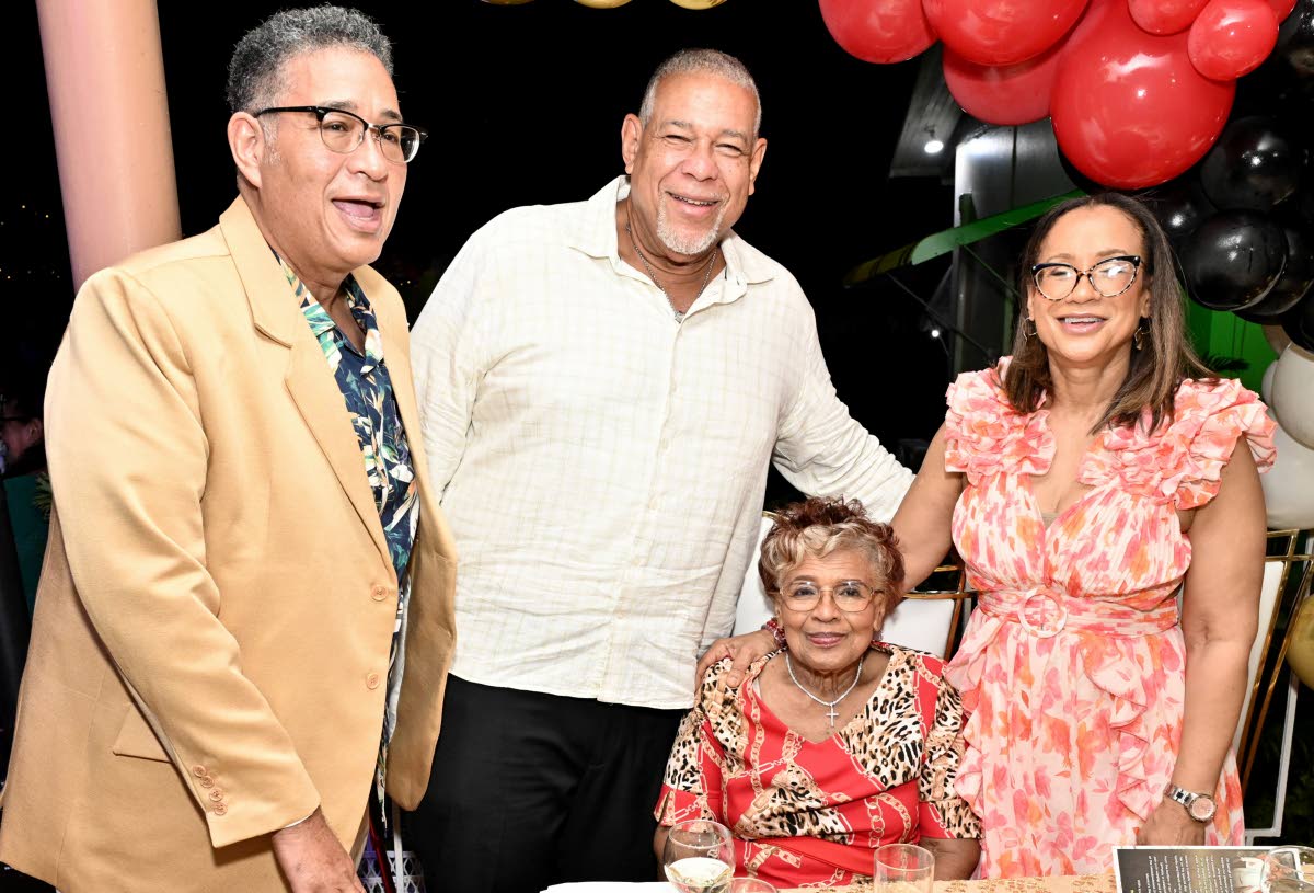 Monica Smith (seated) is surrounded by her children (from left) Deryke Smith, Andre Smith, and Allison Rattray, at her 90th birthday anniversary dinner last Saturday.