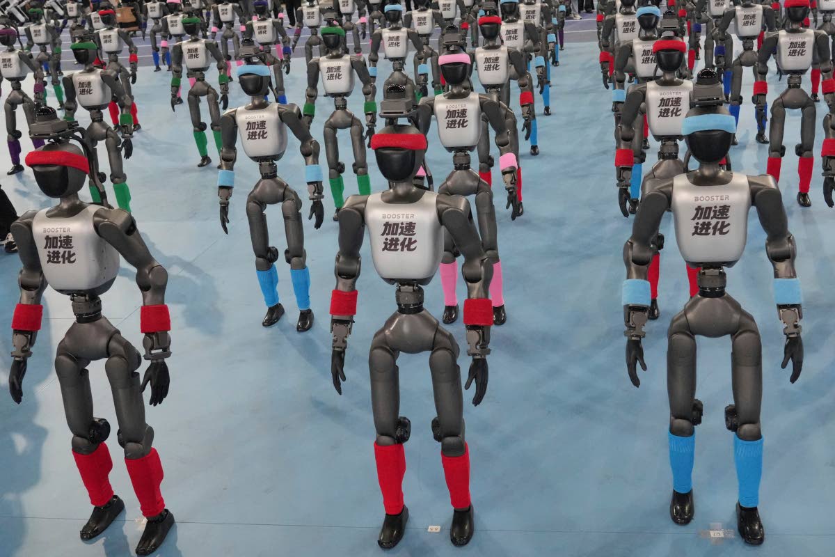 Robots are prepared ahead the opening ceremony of the World Humanoid Robot Games in Beijing, Saturday, Aug. 22, 2026. (AP Photo/Achmad Ibrahim)