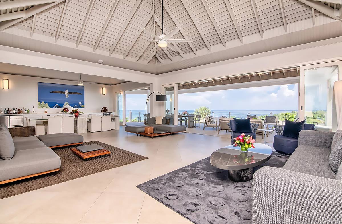 The spacious living room and entertainment balcony. 
