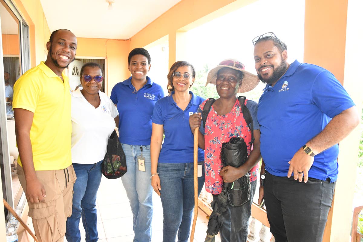 Dorothy Angus (second right), recipient of the ISupport Jamaica fund, shares a moment with members of JN Circle. From left are DeAnte Livingston, member relations officer, JN Group; Mildred Crawford, member of JN Circle Linstead chapter; Pillar Ellington, 