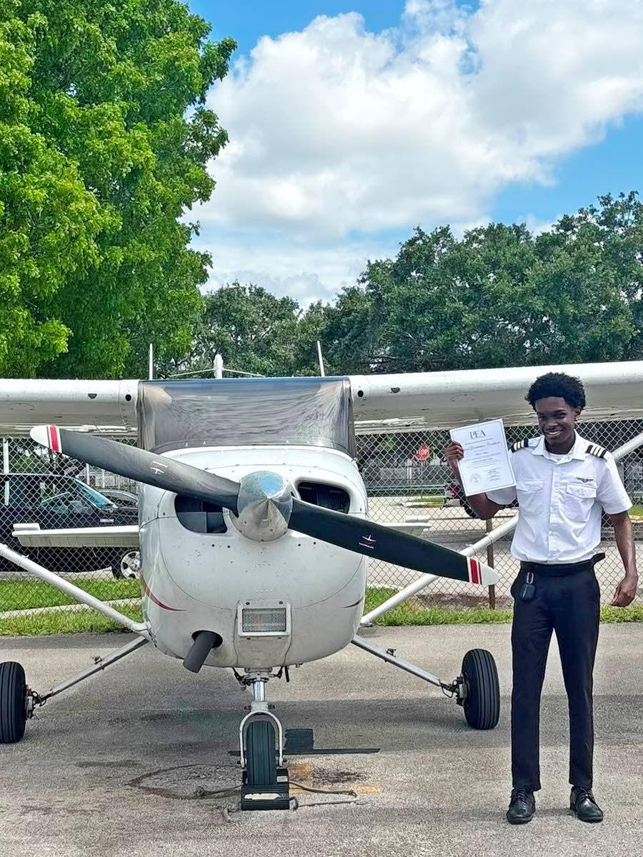 Mikhail Grey with a course completion certificate for his instrument rating.