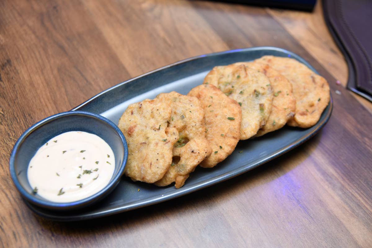 This Jamaican staple, stamp and go, also known as salt fish fritters, will have your taste buds bursting with excitement at every bite.