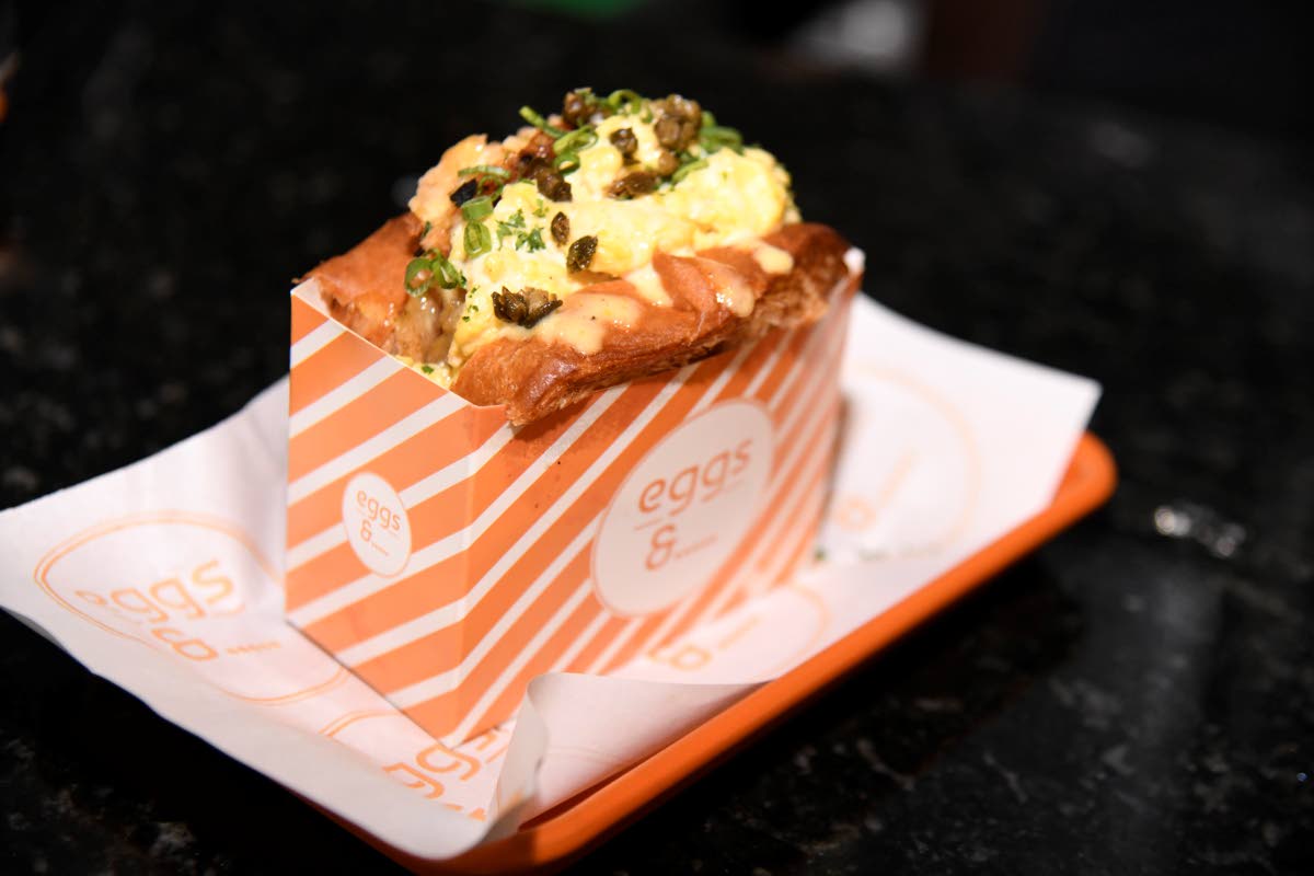 The salmon cake sandwich layers the restaurant’s signature scrambled egg with a salmon cake, Swiss cheese and caramelised pineapple on toasted brioche.