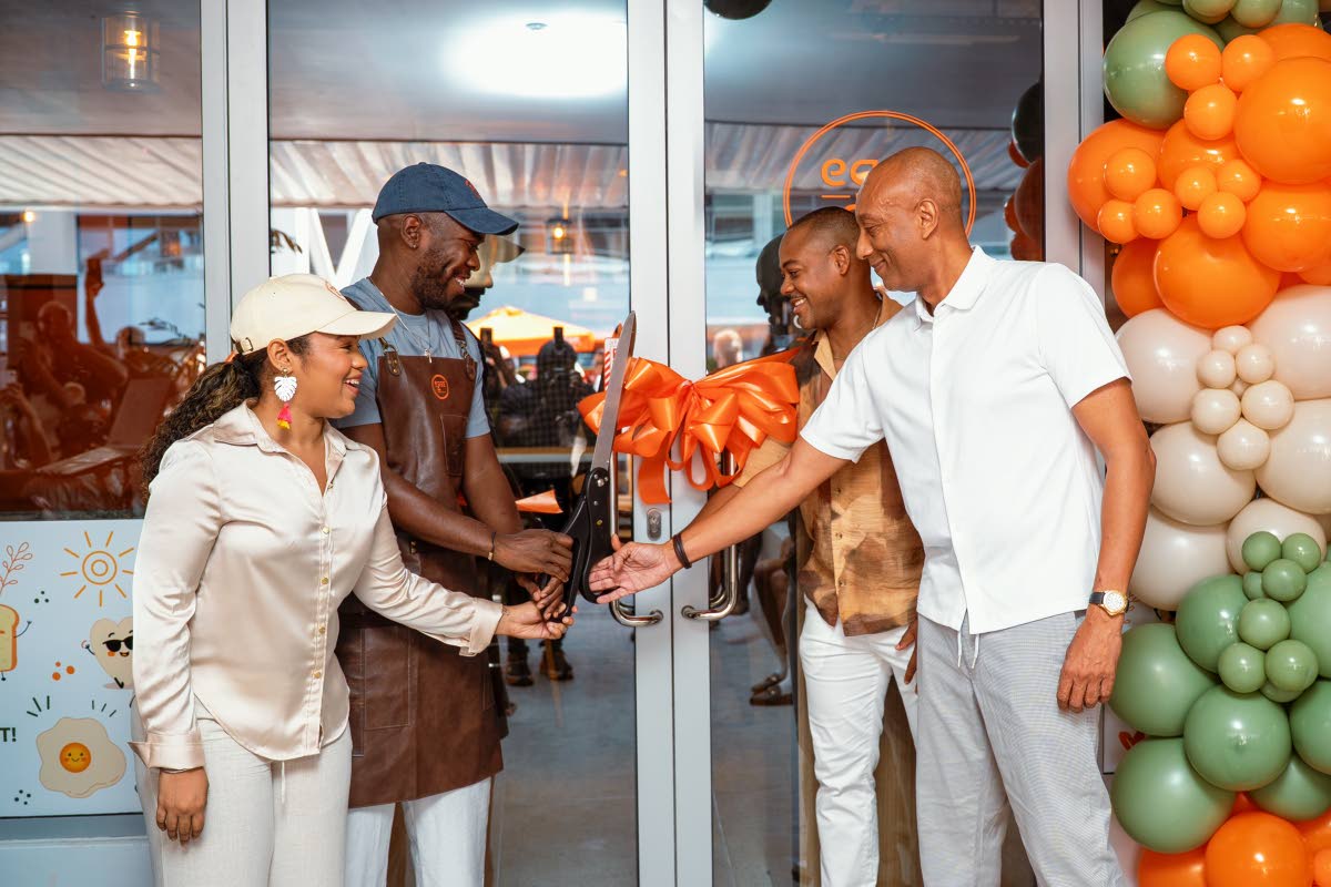 Rorie Hendricks (left), operations manager; Eggs &... co-principals Chef Damion ‘Stewie’ Stewart (second left) and Kwasi Henry (second right); and David Lowe, managing director of the Development Bank of Jamaica, share in the ribbon-cutting ceremony on