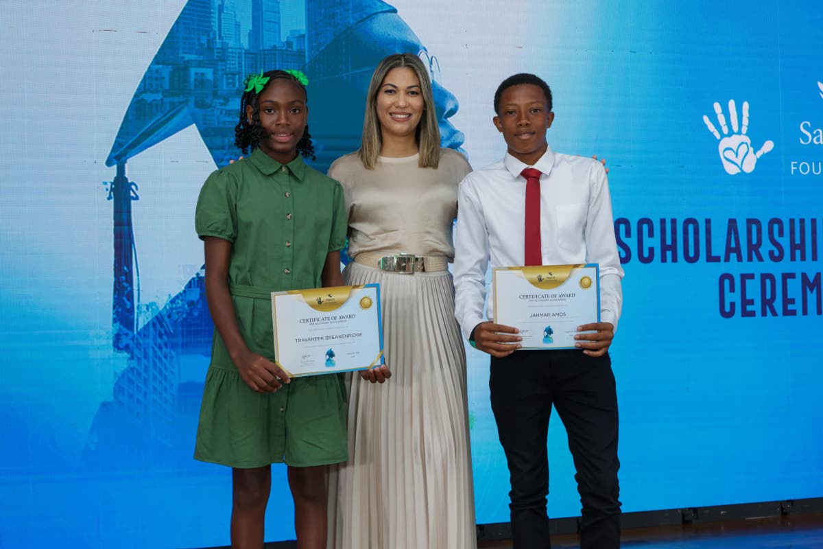 Travaneek Breakenridge (left) and Jahmar Amos, Champion Girl and Champion Boy of the 2026 JTA/Sagicor National Athletics Championships, display their certificates of award alongside Nicole Campbell Robinson, Vice President – Communications, Social Media 
