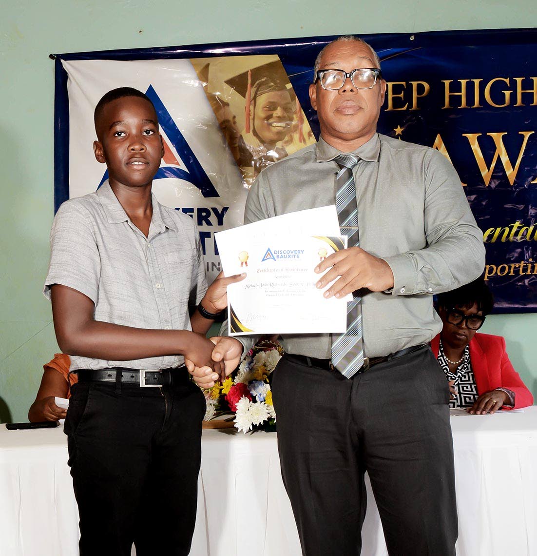 Top boy performer Michael-Josh Richards, of Servite Primary School, accepts his award from Raymon Treasure, principal of York Castle High School.