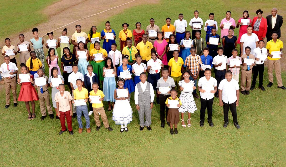 Award recipients pause for a group photograph during Discovery Bauxite’s annual PEP scholarship awards ceremony.