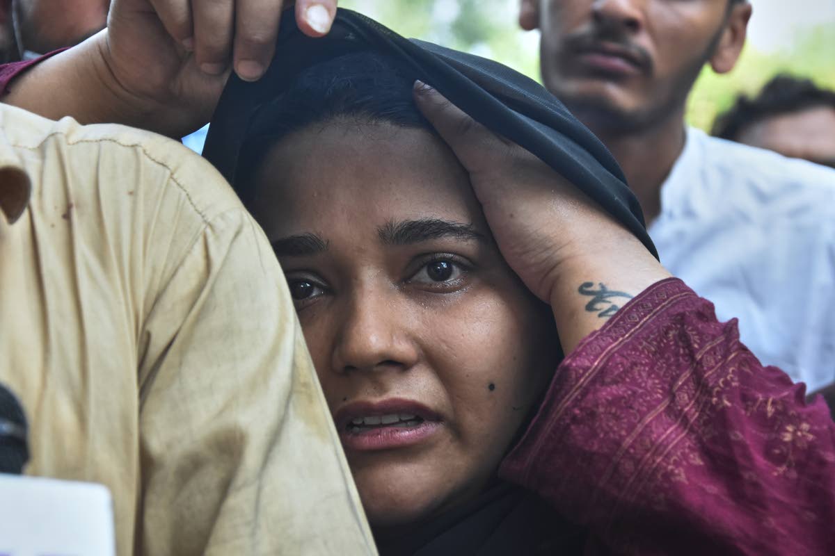 A woman, who lost her baby in a hospital fire, reacts at a hospital in Islamabad, Pakistan, Wednesday.