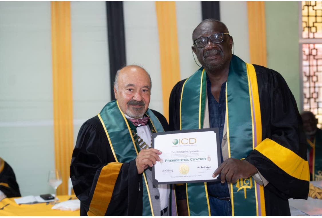 Dr Julio Rodrigues (left), the global president of the International College of Dentists (ICD), presents Dr Christopher Ogunsalu with his prestigious ICD fellowship citation.