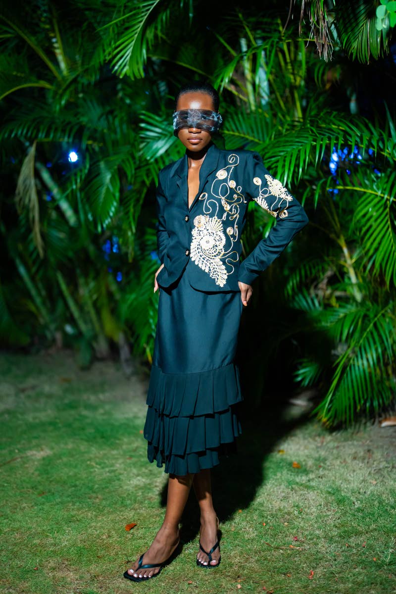 Donyalee Pusey wears a piece inspired by the classic church lady, paying homage to the designer’s roots as a “preacher’s daughter”. The details on the jacket were made by hand and took six hours to construct.